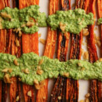 Platter of roasted carrots with arugula pesto