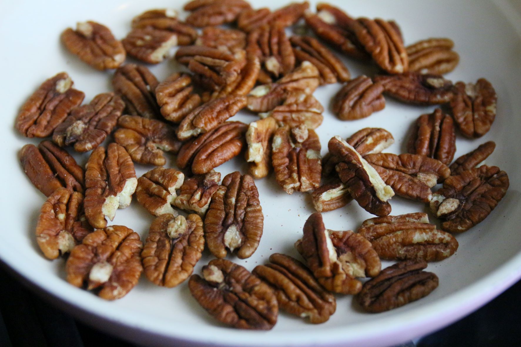 Toasting pecans in a dry pan.