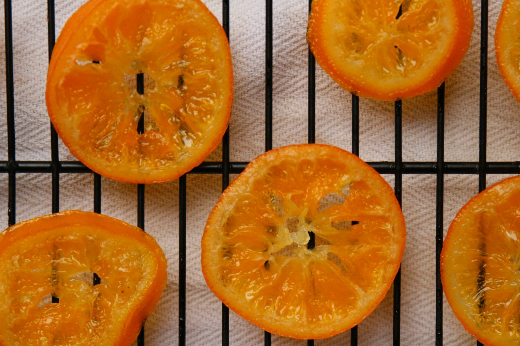 Candied Orange Slices cooling on a rack.