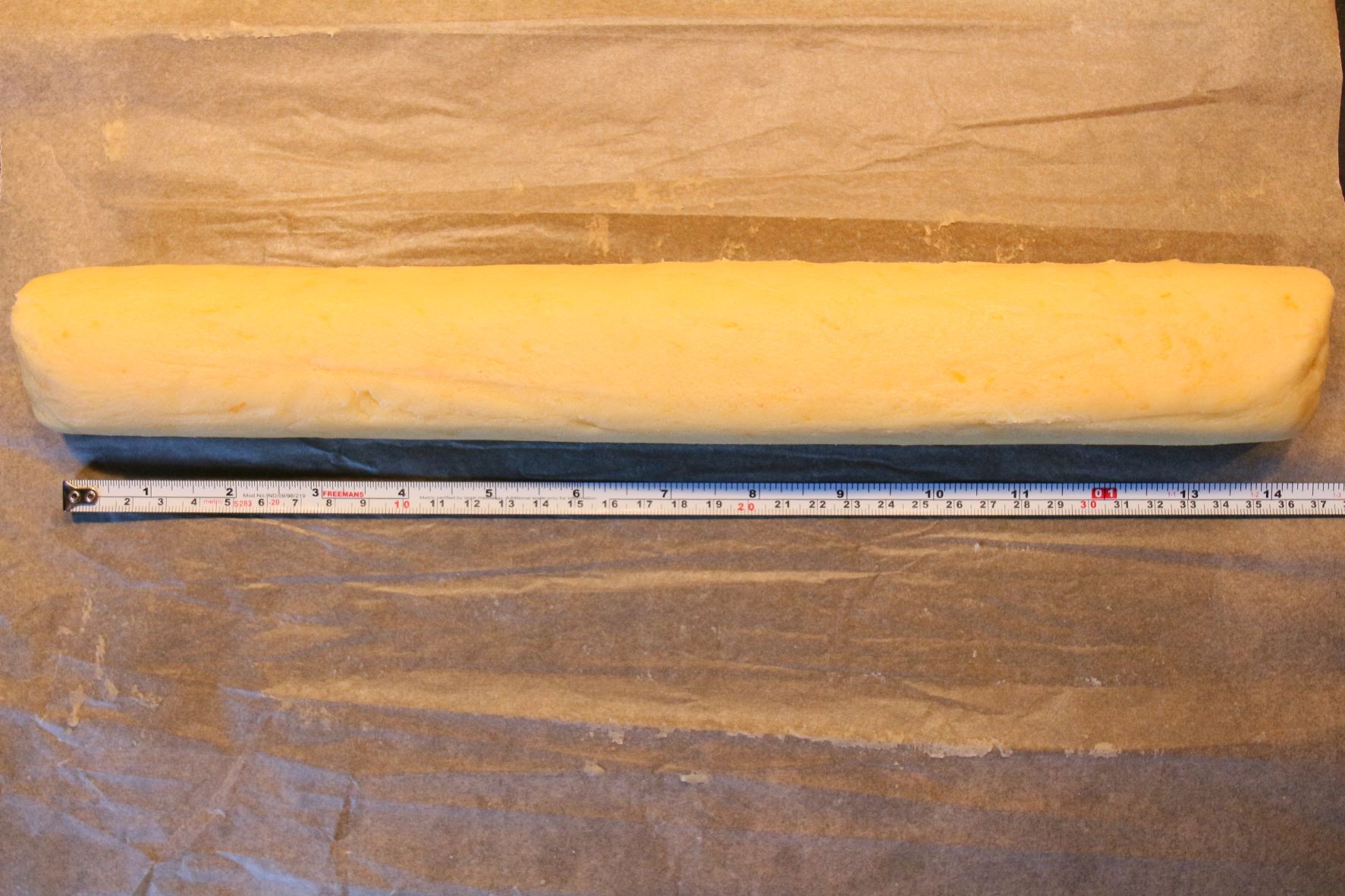 Dough rolled out into a log that is 14 inches long